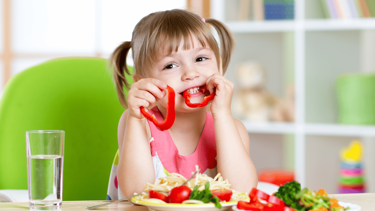 Child eating red pepper nutrition