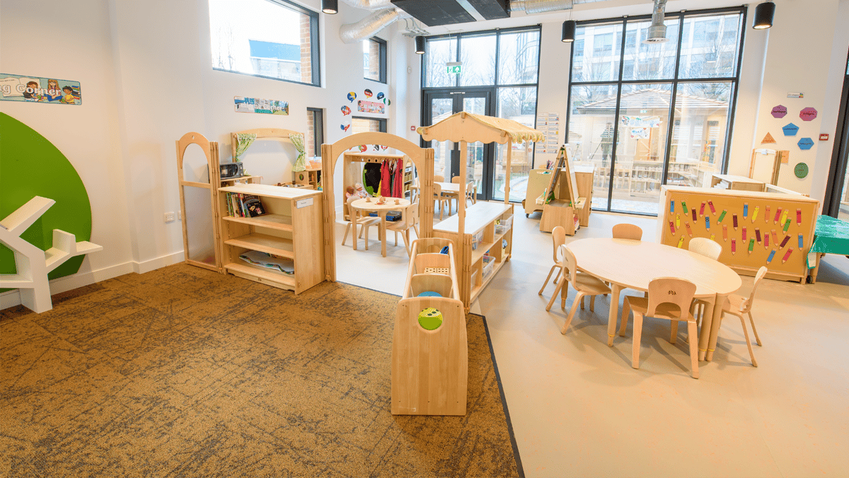 Nursery Interior Wooden Bookcases and Activity Tables